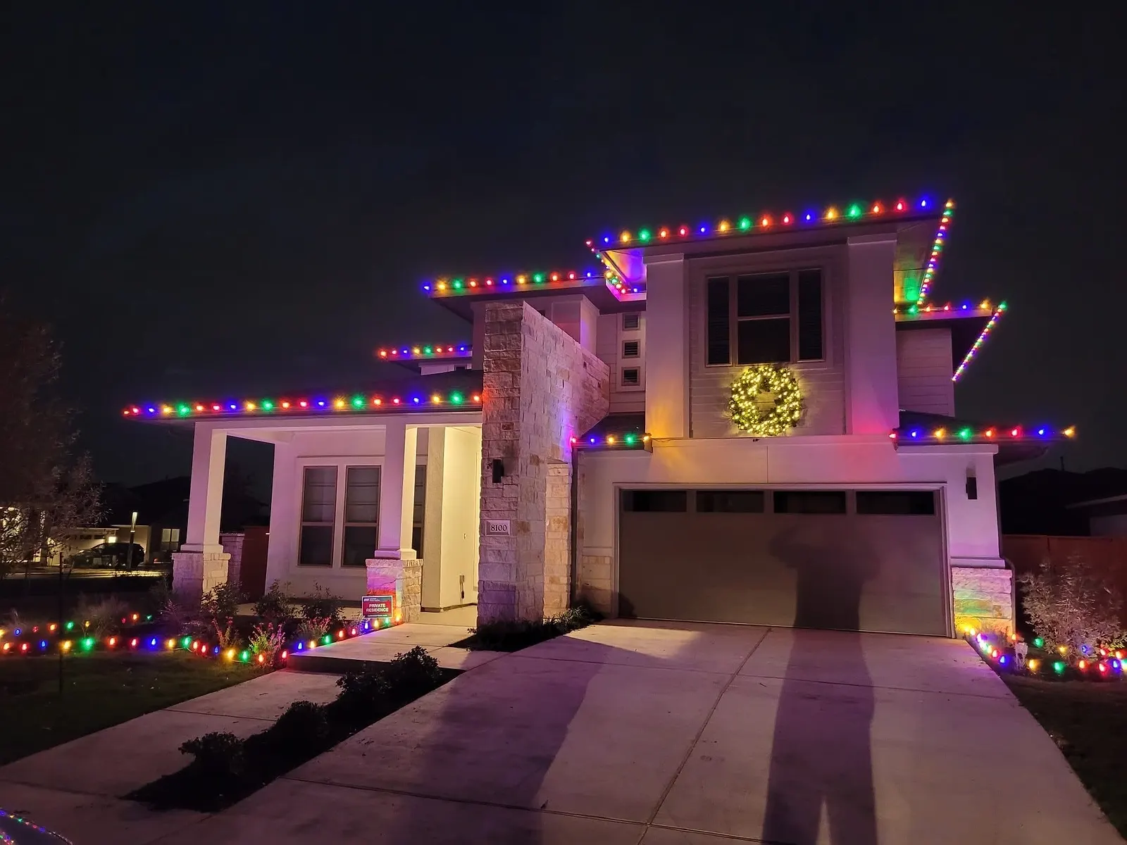 Modern two-story home with multicolor C9 roofline lights